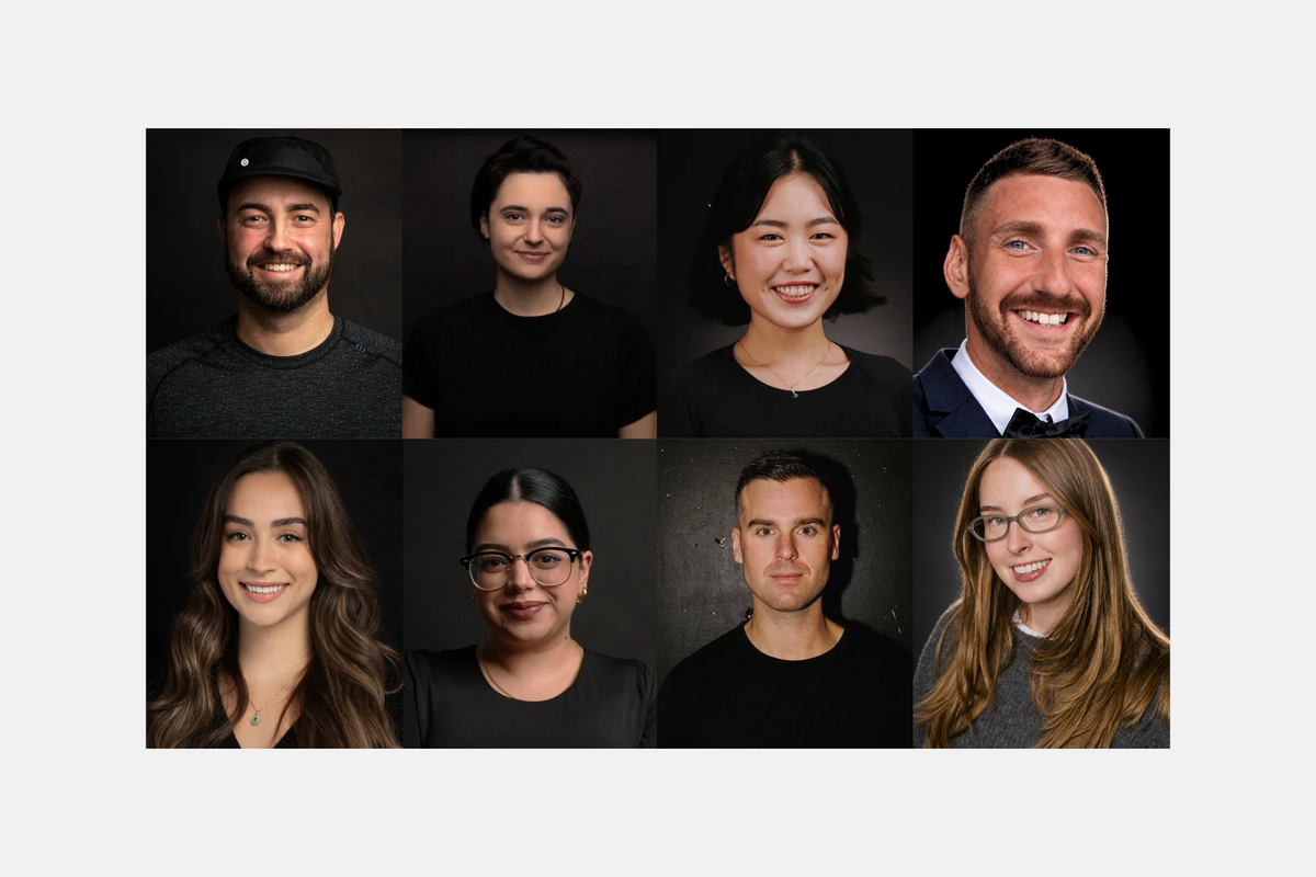A  grid of eight professional headshots of diverse individuals who work at Custom Lab against dark studio backgrounds, arranged on a light gray background.