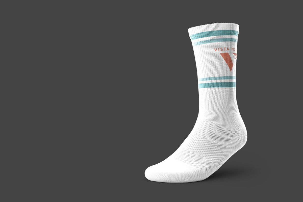 A single white performance crew sock with two teal stripes and a pink 'V' logo, featuring the text 'VISTA POINT'.