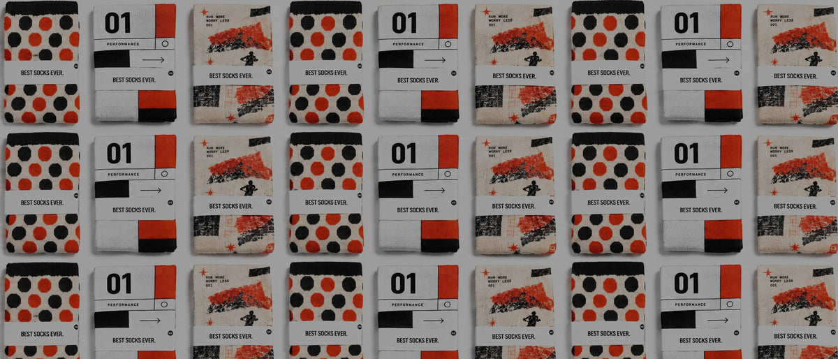 A repeating grid of custom socks arranged in rows. Each sock is wrapped in a white band saying 'BEST SOCKS EVER'. 
