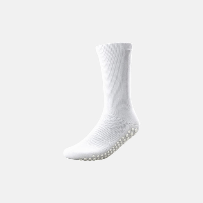 A single white crew grip sock with a textured grip sole, shown floating against a solid light gray background.